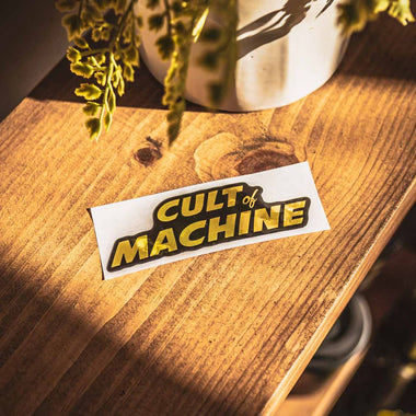 Cult Of Machine. Gold With Black. Sticker